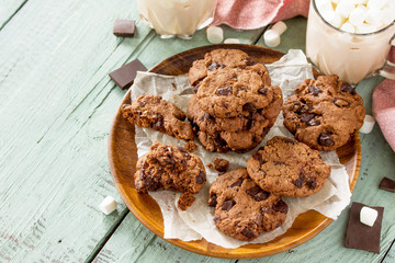 Baked Christmas cookies. Homemade Chocolate Chip Cookies on a light stone table. Free space for your text.