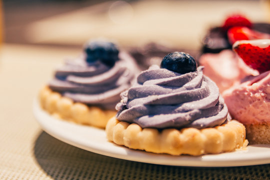 cookies with cream and berries on top