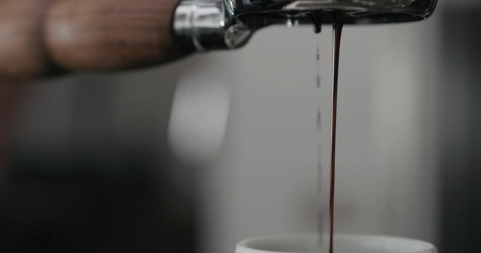 closeup of espresso extraction with bottomless portafilter
