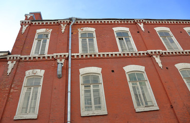 A dilapidated brick building of an old factory of the last century