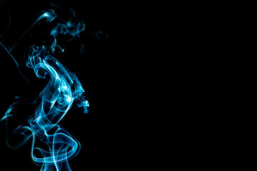Smoke on a black background. Abstraction.