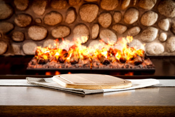 desk of free space and winter background of fireplace 