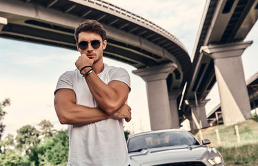 Handsome man near car