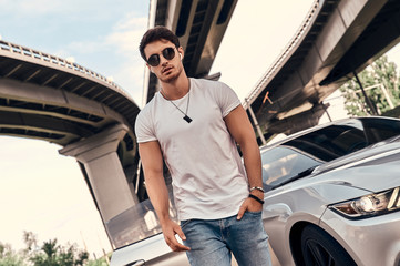 Handsome man near car