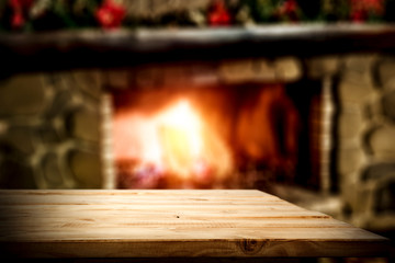 desk of free space and winter background of fireplace 