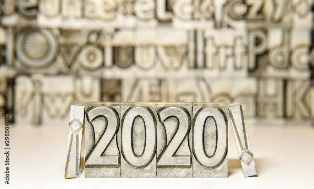 Fototapete happy new year 2020 between exclamation marks on background with press types