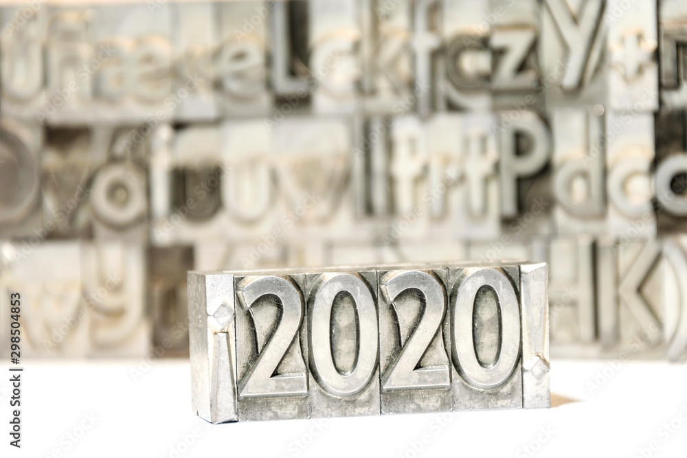 Fototapete happy new year 2020 between exclamation marks on background with press types