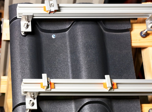 Modern fasteners and roof rails for solar panels.