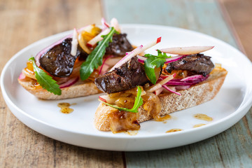 Chicken liver with apple, onion and mango chutney on toast