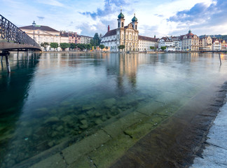 Lucerne. Old city embankment and medieval houses at dawn.