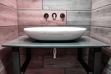 Fototapeta premium Classic modern white washbasins with chrome water tap and soap dish.