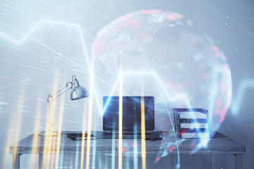 Obraz premium Stock market chart with globe hologram and desktop office computer background. Multi exposure. Concept of financial analysis.