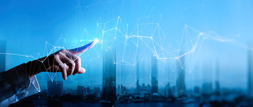 Woman hand touching Wireless network and Connection technology elements covering on Abstract building city. - Powered by Adobe