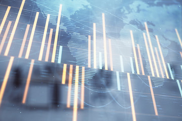 Stock and bond market graph and world map with trading desk bank office interior on background. Multi exposure. Concept of international finance