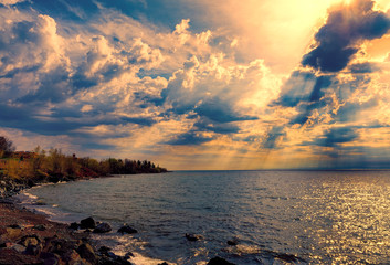 sunset  with golden sun rays over the sea - obrazy, fototapety, plakaty