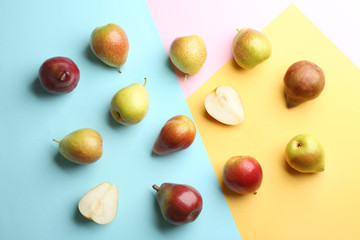 Ripe juicy pears on color background, flat lay
