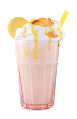 Tasty peach milk shake in glass on white background