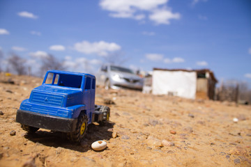 Close up in a blue small toy truck at a dumping ground at the city of Queimada Nova, semiarid region, in the interior of Piauí, Brazil
