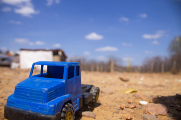Close up in a blue small toy truck at a dumping ground at the city of Queimada Nova, semiarid region, in the interior of Piauí, Brazil