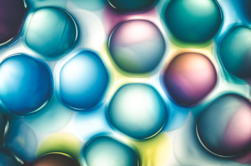 abstract colored microspheres cells in liquid, background