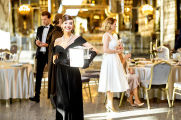 Portrait of an elegant woman celebrating a New Year holiday indoors