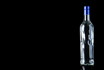 Bottle of vodka on black background. Space for text - obrazy, fototapety, plakaty