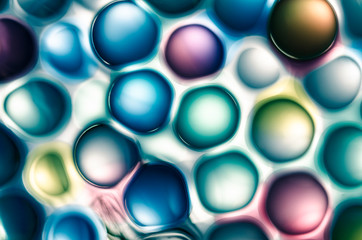 abstract colored microspheres in liquid, background