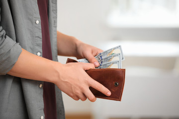 Man with American money in wallet, closeup