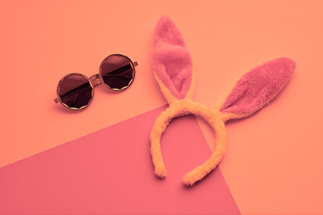 Fashion party girl layout Flat lay. Minimal. Woman Essentials night club accessories. Trendy sunglasses, rabbit. Coloful vibrant pink Set. Creative pop art concept