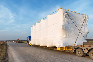 Truck with large oversized cargo on rural road
