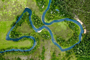 View from above of forest, field and river. Drone shot.