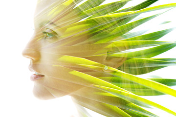 Double exposure of a healthy natural beauty's profile combined with bright green vibrant tropical...