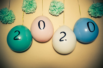 Happy new year 2020 - numbers on air balloons decorations, winter holidays celebration