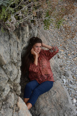 Happy woman relaxing and enjoying at the beach during travel holidays vacation outdoors at ocean or nature sea