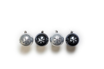 Christmas balls black and grey isolated on white, top view retro design, christmas decoration in a row background