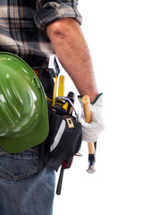 Rear view of a carpenter isolated on a white background; he wears leather work gloves, he is holding a carpenter’s hammer. Work tools industry construction and do it yourself housework. Stock photo.