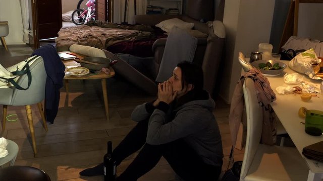 Desperate woman at home with alcohol problem getting drunk