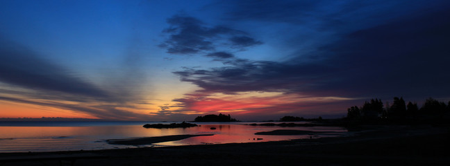 Bright colored morning sky over Lake Vanern. Largest lake of Sweden and the European Union.