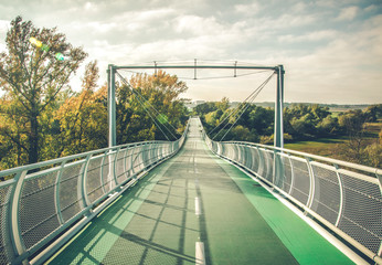 Bridge between between Slovakia and Austria during the sunset. Autumn landscape. Bicycle trail to Schloss Hof castle.