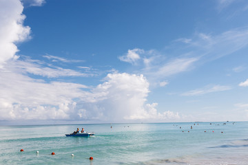 Happy tourists kayaking in the transparent water of Caribbean, Varadero, Cuba