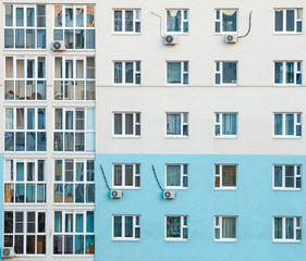 Fototapeta premium Windows of a multi-storey building opposite the blue-white color. Without people