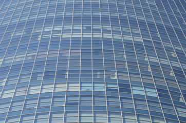 Modern architectural background of the glass facade of the building