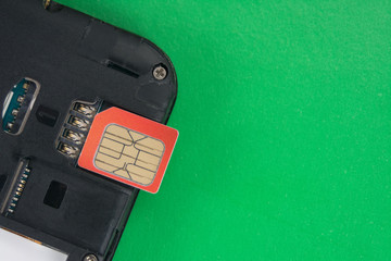 SIM card close-up next to the connector in the smartphone, phone