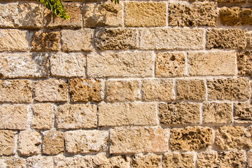 An old, white limestone wall.