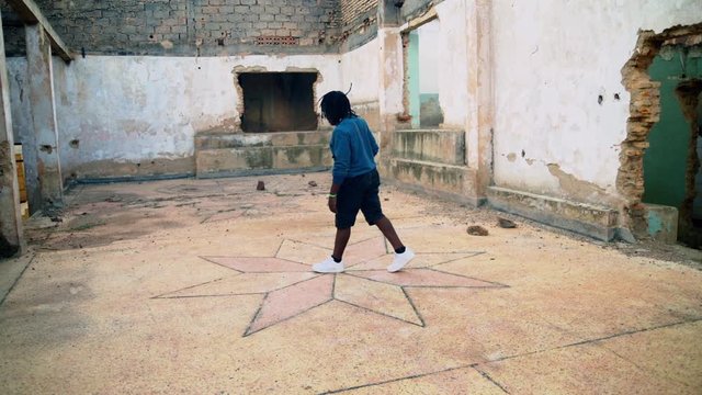 Talented young parkour guy doing tricks inside the ware house after a long run from outside wide angle shoot by nikon z6 with ninja 4k 
