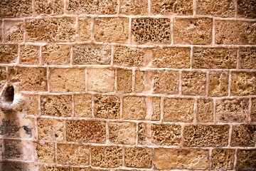 An old, white limestone wall.