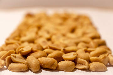 Salty peanut isolated on white background