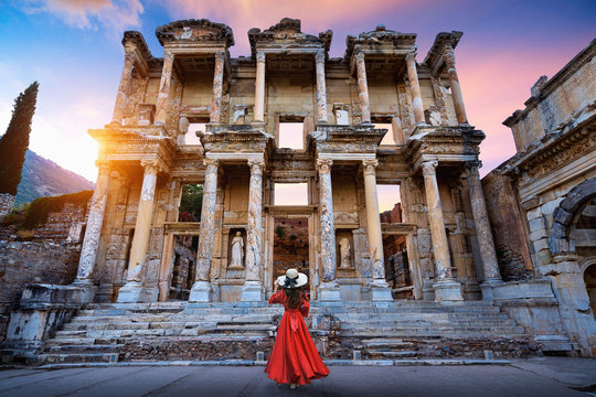 Woman standing in Celsius Library at Ephesus ancient city in Izmir, Turkey.