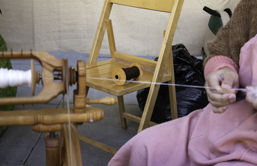 Spinning wool on spinning wheel