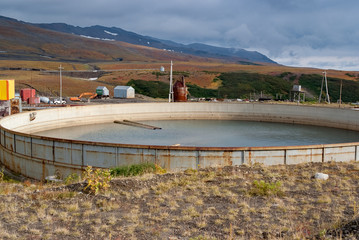 dirty water in large water tank, the concept of conservation and processing of water resources, water conservation of the planet